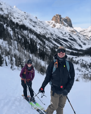 Shannon and Cole ski touring in the mountains